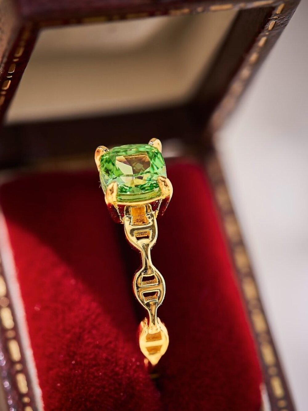 Golden Ring with Vibrant Green Gemstone